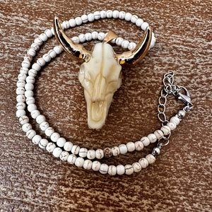 Statement Piece! This Bull Skull Necklace turns heads with gold plated horns.